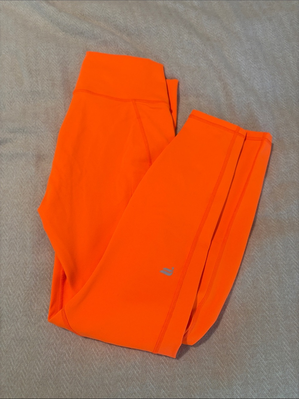 Fabletics High-Waist Ankle Crop Leggings in Bright Orange